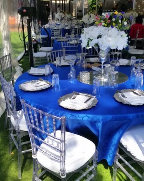51674681 644309459337250 5369398681386713761 n - Beautiful white and blue setup done using a Marquee, clear Chiavari chairs, plat...
