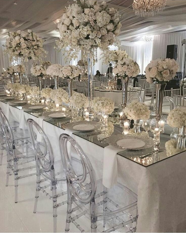 40826012 616341755428906 5708523698474661477 n - All White Wedding Inspiration Featuring High Lush Centerpieces used on Glass Mir...