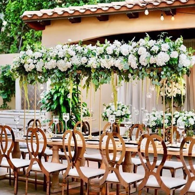124096398 114072313717581 259235225776041858 n - These tall floral centerpieces with the rose gold butterfly chairs did it for us in this decor inspi...